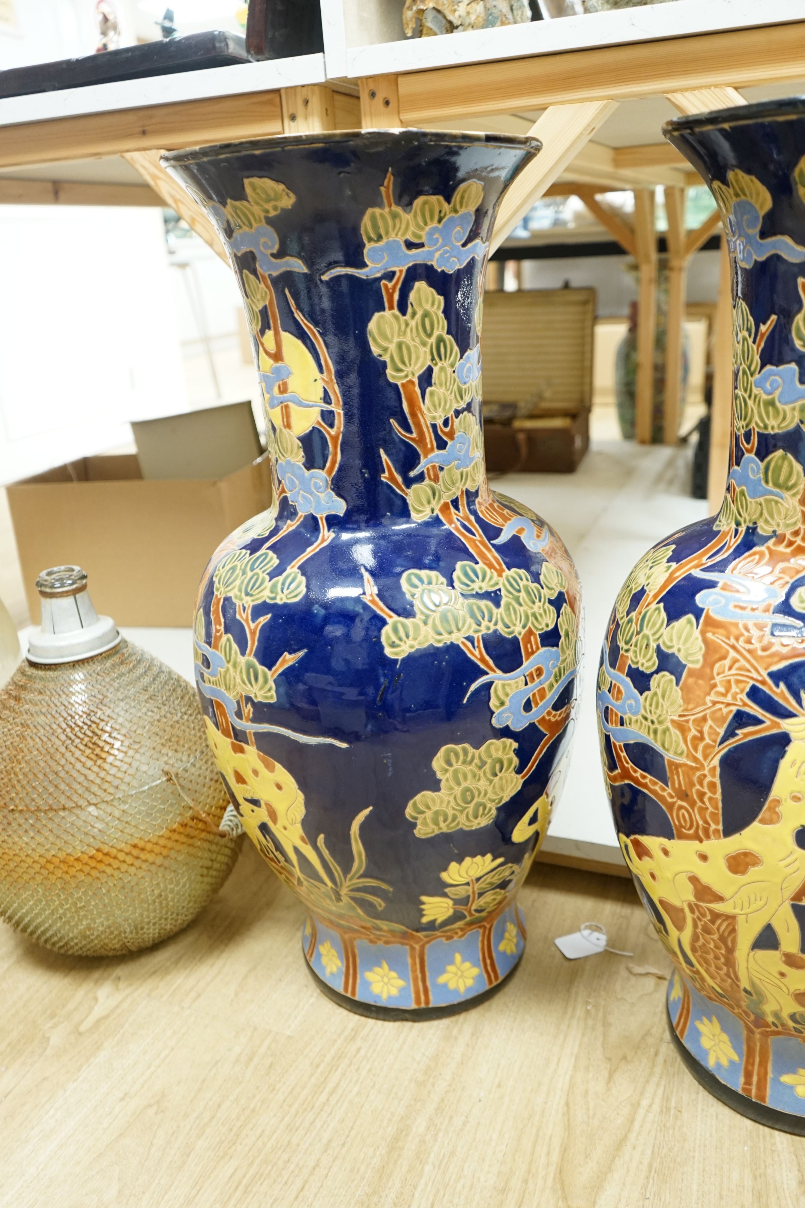 A pair of large Chinese polychrome pottery baluster vases, 82 cm